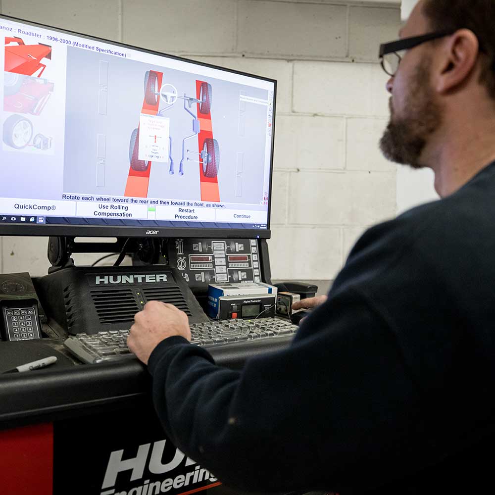 Technician using Hunter alignment computer