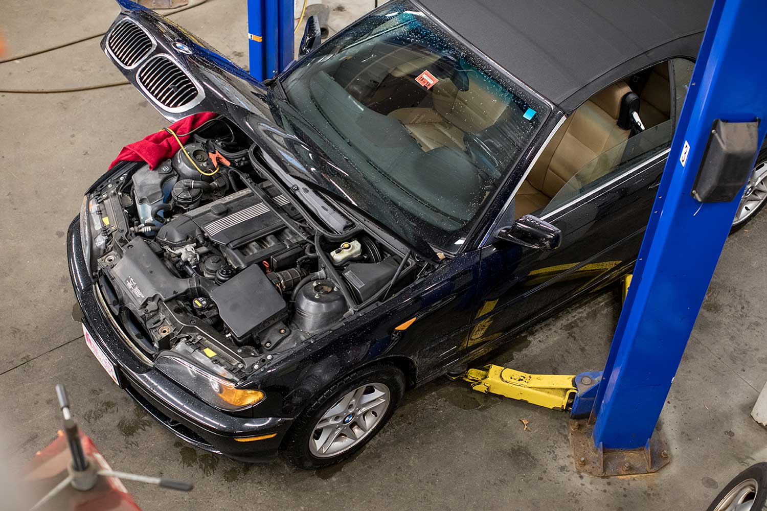 BMW on lift with hood open
